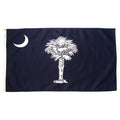 South Carolia state flag with a white palm tree and moon on a blue background
