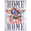 Decorative sign with a star, flowers, and 'Home Sweet Home' text on a wooden background.