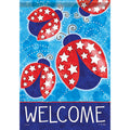 Decorative flag with red and blue ladybugs and stars on a blue background with 'WELCOME' text.