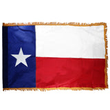 Texas state flag with blue, white, and red colors and a star on a white background
