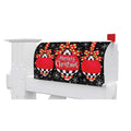 White mailbox with a Christmas-themed cover featuring red ornaments and snowflakes on a black background.