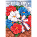 Decorative flag with red, white, and blue flowers and a bow on a wooden surface.