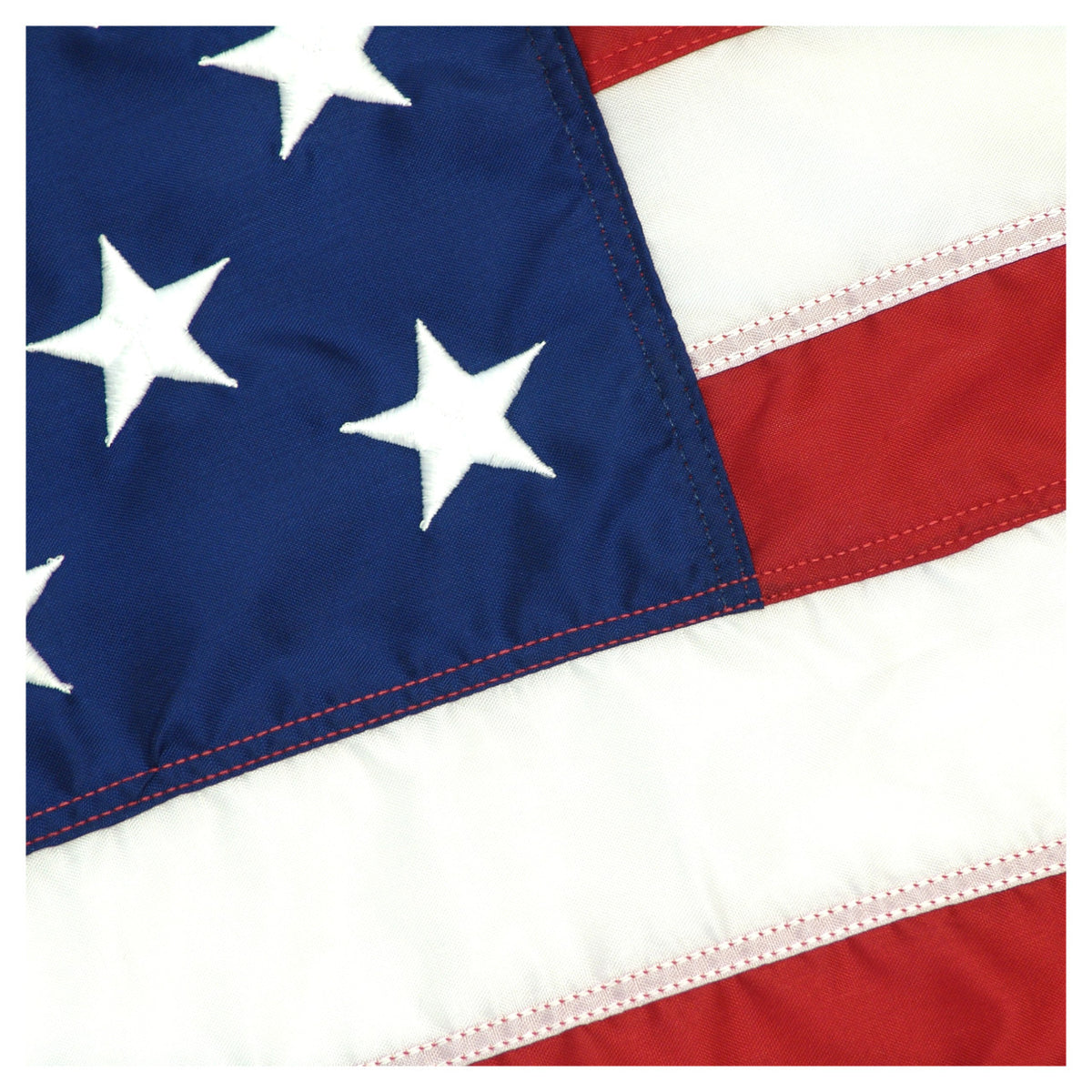 Close-up of an American flag with white stars on a blue field.