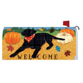 Mailbox cover with a black dog, pumpkins, and 'Welcome' text on a yellow background.
