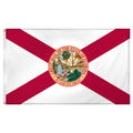 State of Florida flag featuring the classic red diagonal cross on a white background with the full-color Florida state seal in the center.  The words 'GREAT SEAL OF THE STATE OF FLORIDA' and 'IN GOD WE TRUST' are written on the edges of the seal.