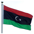 Red, black, and green flag of Libya with a white crescent moon and a star