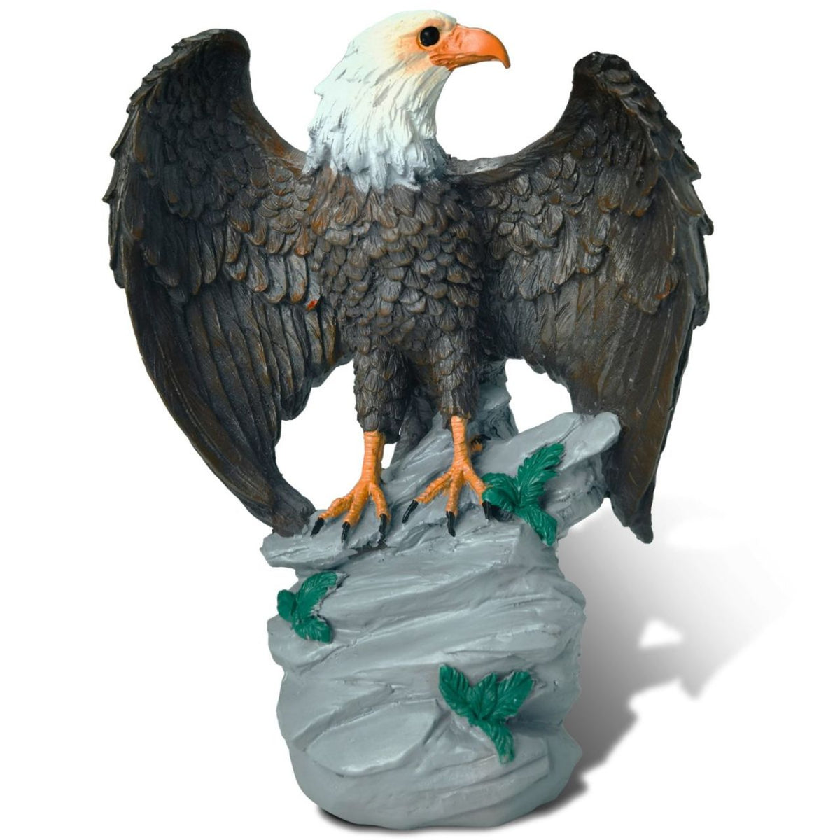 Statue of an eagle perched on a rock with a white background