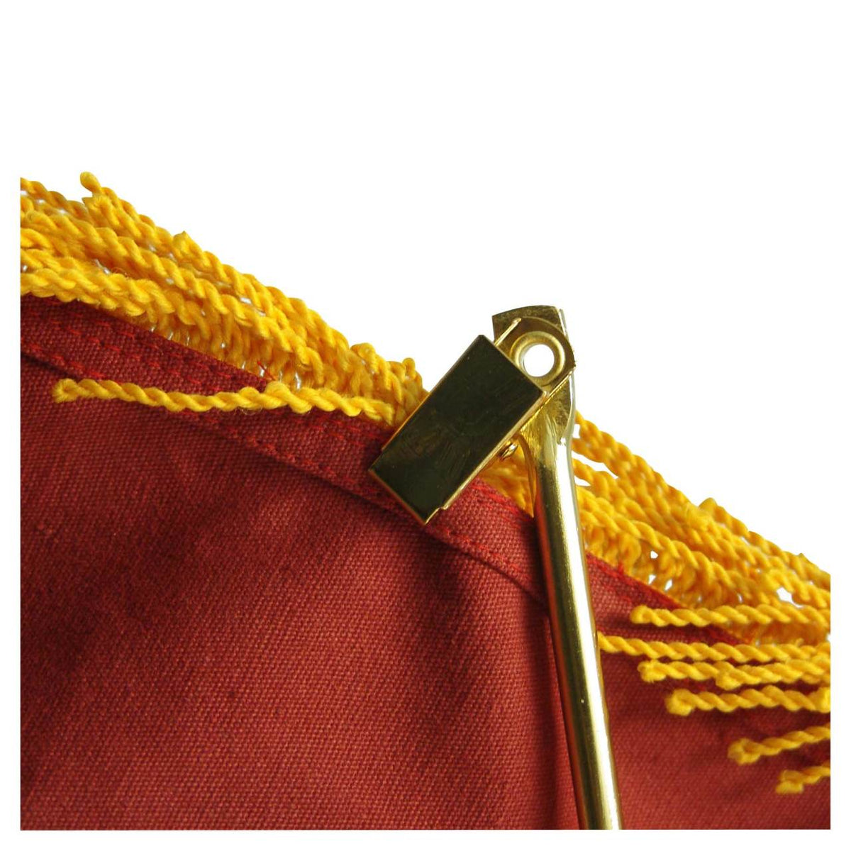 Close up of a gold spreader for an American flag installed
