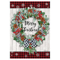 Decorative flag with Christmas wreath with berries, pinecones, and plaid ribbons on a white background with red and black checkered border.
