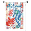 Decorative garden flag with a seahorse, coral, and starfish design on a striped background with the word 'Welcome'.