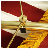 Close up of a gold spreader for an American flag installed