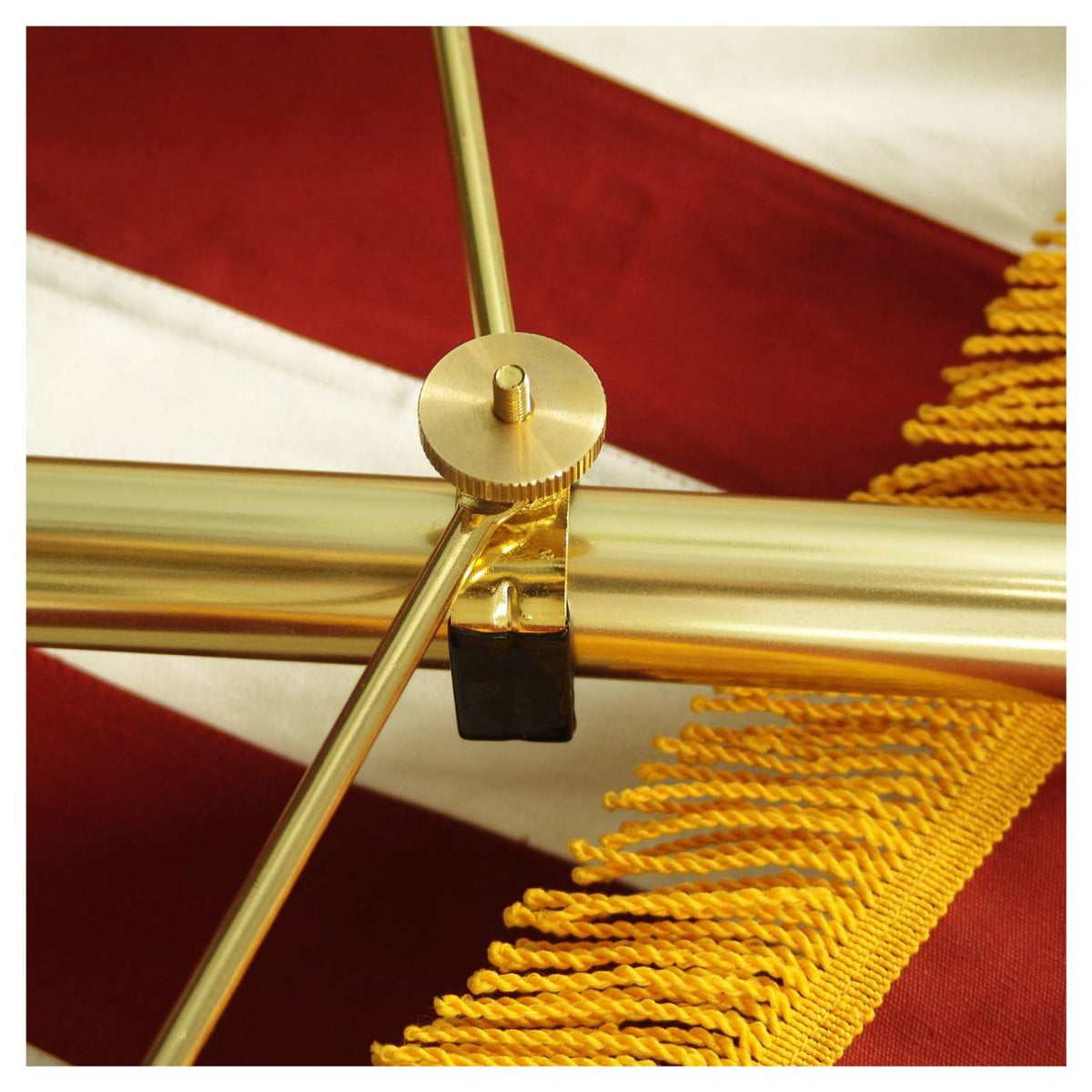 Close up of a gold spreader for an American flag installed