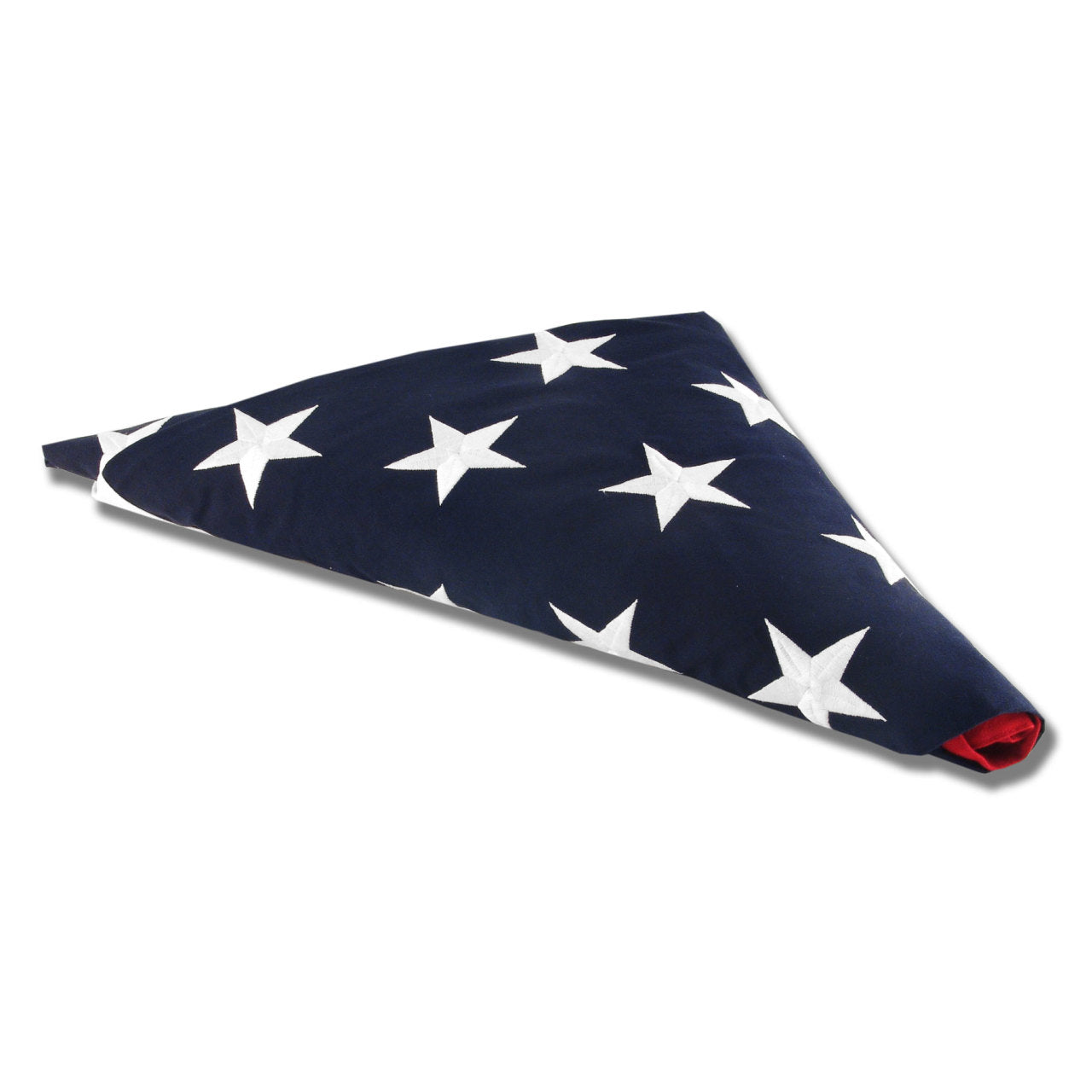 A folded American flag in a triangle with the blue canton and white stars on top on a white background