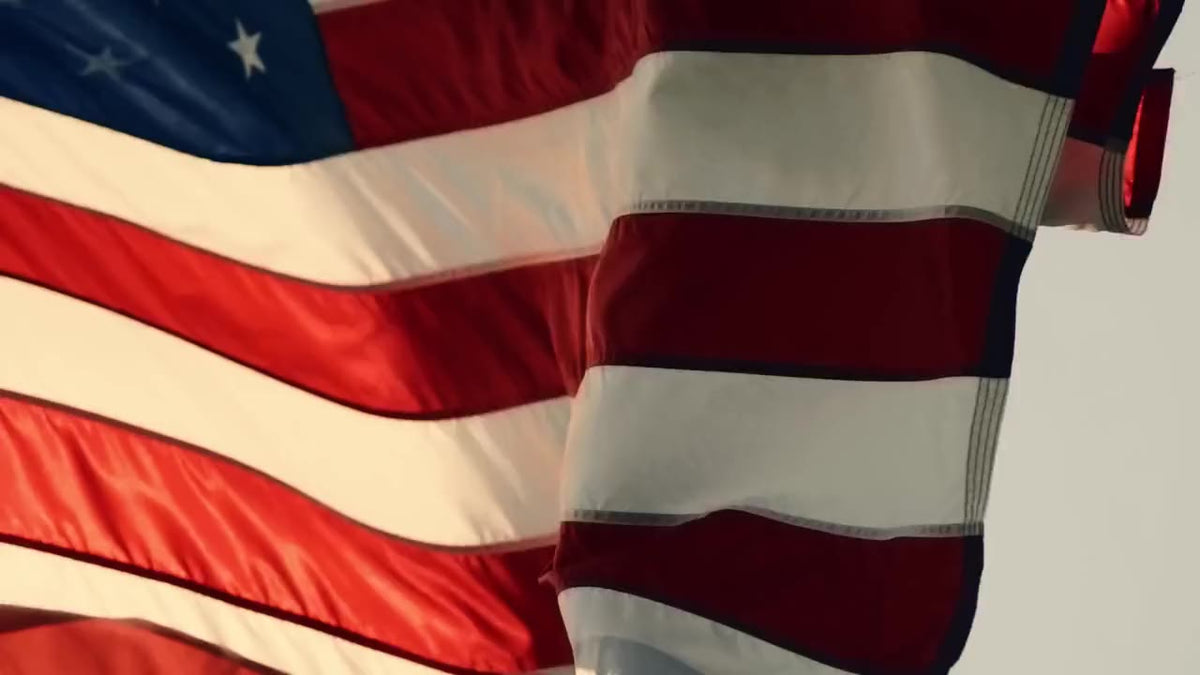 An American flag flying on its pole